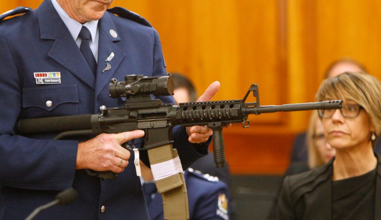 Police Sr. Sgt. Paddy Hannan shows New Zealand lawmakers an AR-15 style rifle similar to one of the weapons a gunman used to slaughter 50 people at two mosques, in Wellington on April 2, 2019.