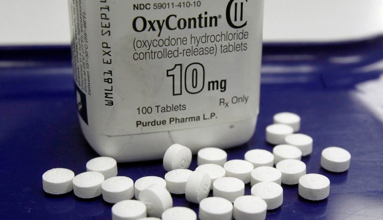 This Feb. 19, 2013, photo shows OxyContin pills arranged for a photo at a pharmacy, in Montpelier, Vt. The wealthy family who owns the company that makes OxyContin says Massachusetts got the facts wrong in a lawsuit. Legal papers made public Tuesday, April 2, 2019, represent the first time the Sackler family, who owns the Connecticut-based Purdue Pharma, has responded in court to allegations about its role in the opioid crisis. 