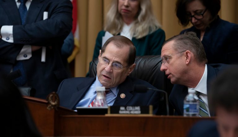 House Judiciary Committee Chair Jerrold Nadler, D-N.Y., joined at right by Ranking Member Doug Collins, R-Ga., confer before a resolution was passed to subpoena special counsel Robert Mueller's full report, on Capitol Hill in Washington, Wednesday, April 3, 2019. 