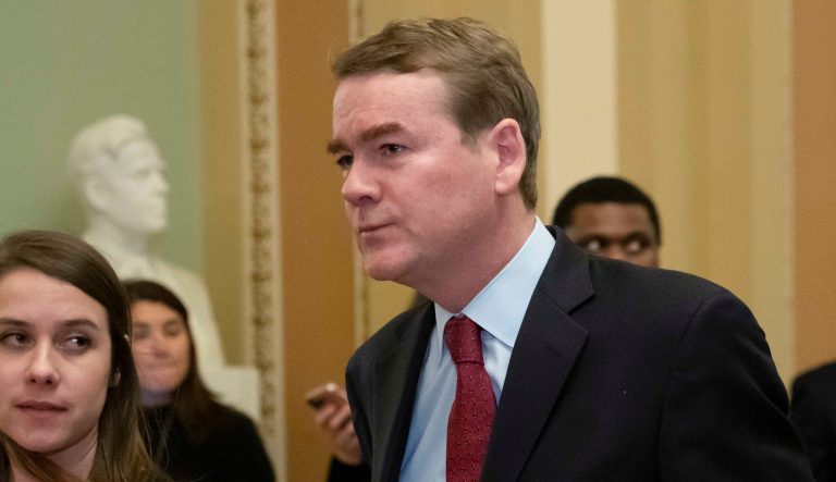 In this Jan. 24, 2019 photo, Sen. Michael Bennet, D-Colo., leaves the chamber at the Capitol in Washington. 