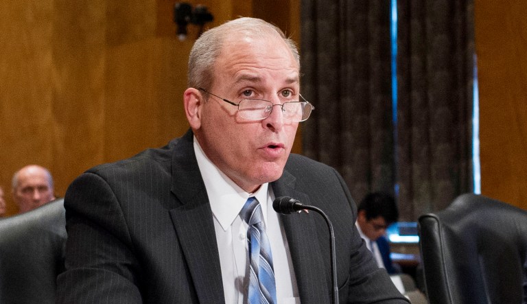 Mark Morgan is shown at a hearing.