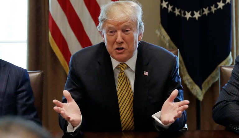 President Donald Trump speaks during the White House Opportunity and Revitalization Council meeting in the Cabinet Room of the White House, Thursday, April 4, 2019, in Washington. Shown with the President are Scott Turner, Executive Director of the White House Opportunity and Revitalization Council, right, and Joe Grogan, Assistant to the President for Domestic Policy and Vice Chair of the White House Opportunity and Revitalization Council, left.