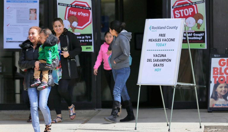 FILE - In this March 27, 2019 file photo, signs advertising free measles vaccines and information about measles are displayed at the Rockland County Health Department, in Pomona, N.Y. A state Supreme Court judge is expected to rule Friday, April 5,  on the legality of Rockland County Executive Ed Day's order, banning children from public places unless they've been vaccinated against measles, which is part of efforts to stop a measles outbreak that has infected more than 160 people since October. 