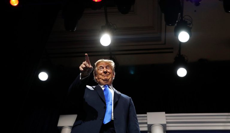 President Donald Trump smiles and points at Republican mega-donor Sheldon Adelson, as Trump arrives to speak at the Republican Jewish Coalition's annual leadership meeting, Saturday April 6, 2019, in Las Vegas. 