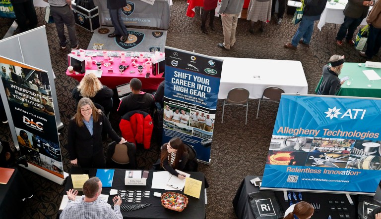 Vsitors to the Pittsburgh veterans job fair meet with recruiters at Heinz Field in Pittsburgh.