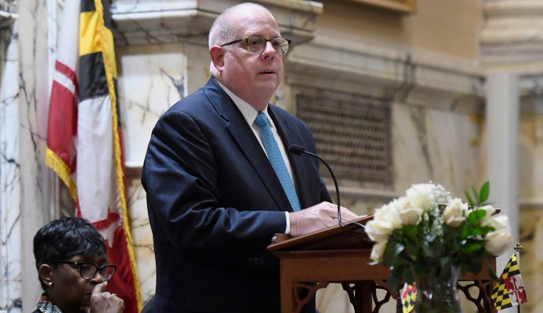 Maryland Gov. Larry Hogan addresses a joint legislative session convened to honor Maryland House Speaker Michael Busch, as Speaker Pro Tem Adrienne Jones, left, listens, in Annapolis, Md., Monday, April 8, 2019.
