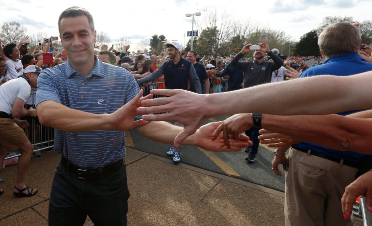 Virginia head coach Tony Bennett, greets fans as he and his team are welcomed back home after their win of the championship in the Final Four NCAA college basketball tournament against Texas Tech, in Charlottesville, Va., Tuesday, April 9, 2019. 