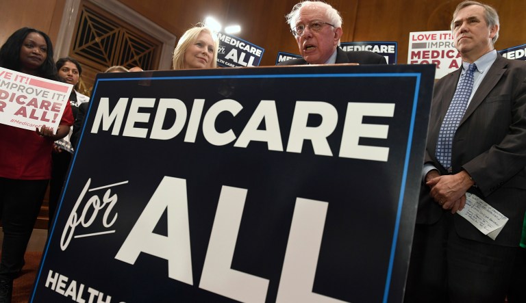 Sen. Bernie Sanders, I-Vt., second from right, speaks during a news conference on Capitol Hill in Washington, Wednesday, April 10, 2019, to reintroduce his "Medicare for all" legislation to create a government-run health insurance plan. Sanders is flanked by Sen. Kirsten Gillibrand, D-N.Y., left, and Sen. Jeff Merkley, D-Ore., right. 