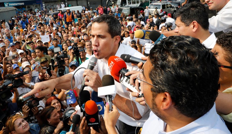 Opposition leader Juan GuaidÃ³, who has declared himself Venezuela's interim president, speaks to supporters during a rally in San Martin Caracas, Venezuela, Wednesday, April 10, 2019.