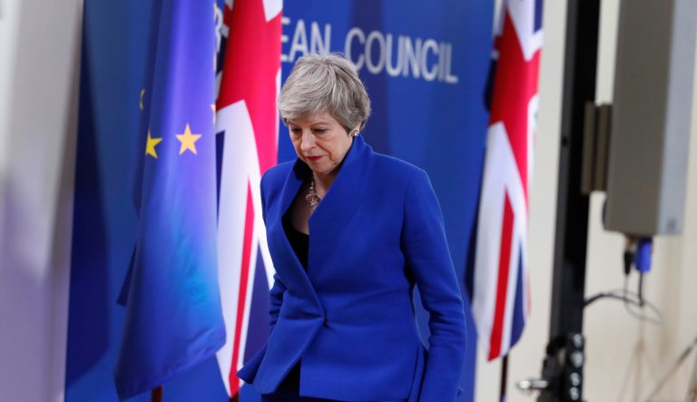 British Prime Minister Theresa May leaves the podium after addressing a media conference at the conclusion of an EU summit in Brussels, Thursday, April 11, 2019. European Union leaders on Thursday offered Britain an extension to Brexit that would allow the country to delay its EU departure date until Oct. 31. 