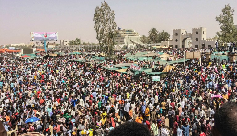 Sudanese celebrate after officials said the military had forced longtime autocratic President Omar al-Bashir to step down after 30 years in power in Khartoum, Sudan, Thursday, April 11, 2019. 