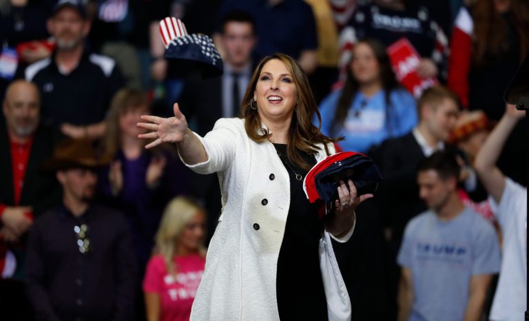 Republican National Committee Chairwoman Ronna McDaniel throws hats to the audience at a rally for President Donald Trump in Grand Rapids, Mich., Thursday, March 28, 2019. 