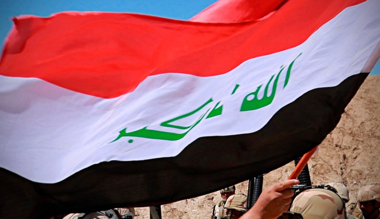 The flag of Iraq is seen.
