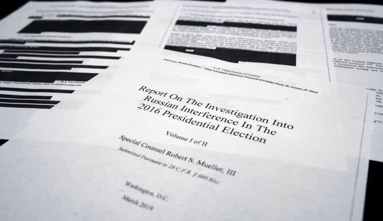 Four pages of special counsel Robert Mueller report on the witness table in the House Intelligence Committee hearing room on Capitol Hill, in Washington, Thursday, April 18, 2019.
