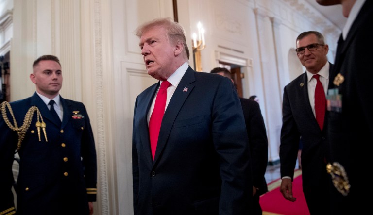 President Donald Trump arrives for a Wounded Warrior Project Soldier Ride event in the East Room of the White House, Thursday, April 18, 2019, in Washington. Also pictured is Wounded Warrior Project CEO Michael Linnington, right.