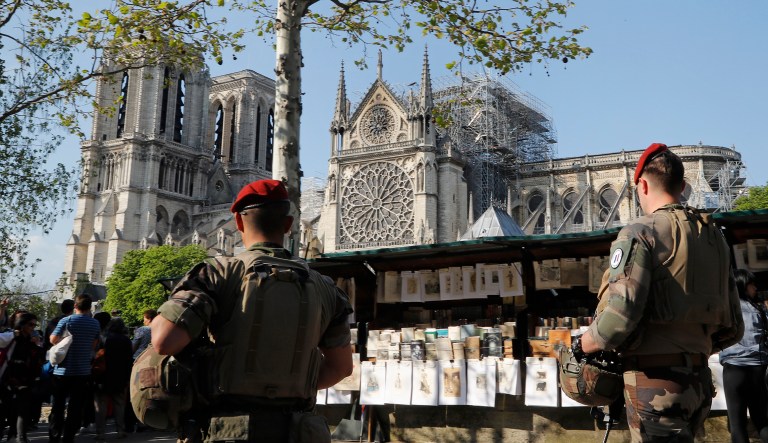 French soldiers patrol along the Notre Dame Cathedral in Paris, Friday, April 19, 2019.