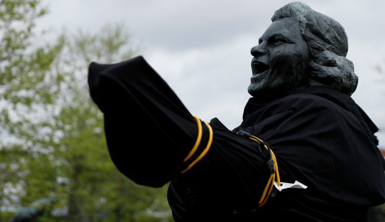 A partially covered statue of singer Kate Smith is seen near the Wells Fargo Center, Friday, April 19, 2019, in Philadelphia.