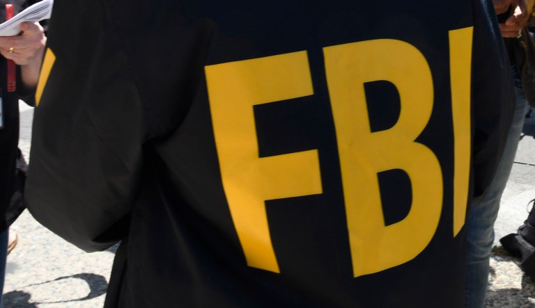 An FBI agent talks to people.