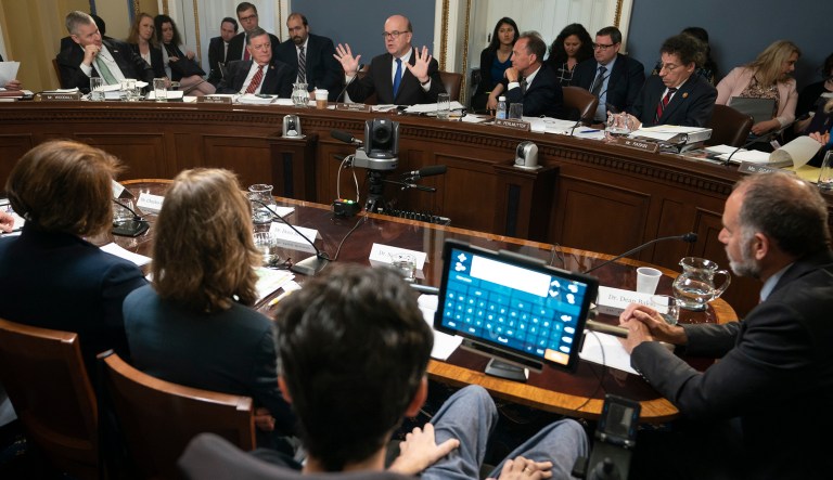 House Rules Committee Chairman Rep. Jim McGovern, D-Mass., top center, leads a hearing on a "Medicare for All" bill for government-provided health care, on Capitol Hill in Washington, Tuesday, April 30, 2019. Ady Barkan, a high-profile health care activist who suffers from Amyotrophic lateral sclerosis, testifies from his wheelchair at bottom.