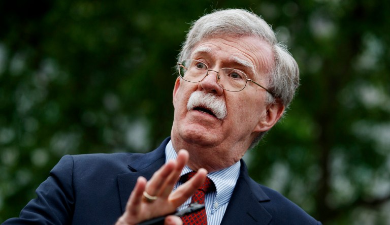 National security adviser John Bolton talks to reporters.