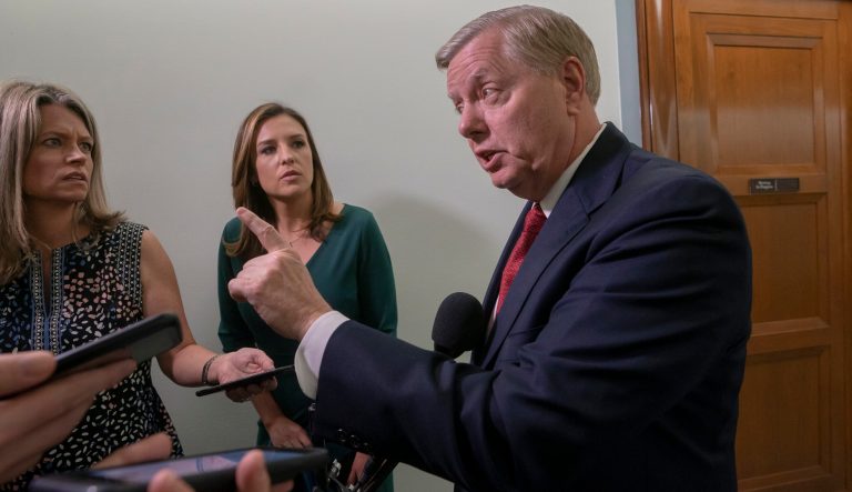 Senate Judiciary Committee Chairman Lindsey Graham, R-S.C., answers questions from reporters outside the hearing room after Attorney General William Barr testified about the Mueller report, on Capitol Hill in Washington, Wednesday, May 1, 2019. 