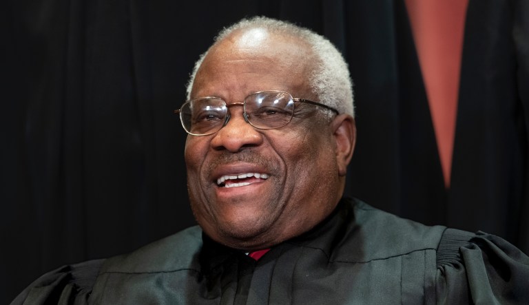 Associate Justice Clarence Thomas, appointed by President George H.W. Bush, sits with fellow Supreme Court justices for a group portrait at the Supreme Court Building in Washington, Friday, Nov. 30, 2018. 