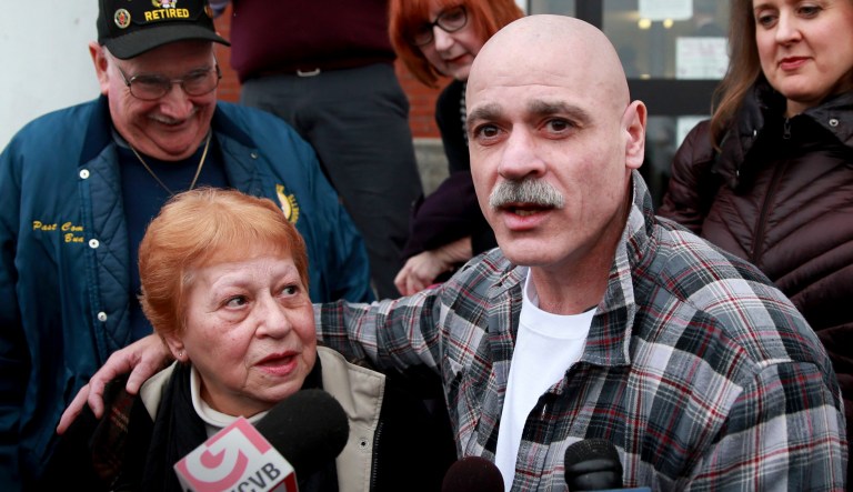 George Perrot, right, with his mother Beverly Garrant, talks to the media in front of the Bristol County Superior Court after he was released following his bail hearing in New Bedford, Mass.