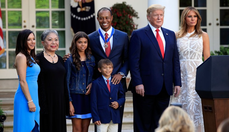 President Trump, first lady Melania Trump, and Tiger Woods pose for a picture with, from left, Woods' girlfriend Erica Herman, his mother Kultida Woods, children Sam Alexis Woods and Charlie Axel Woods during a ceremony awarding Woods with the Presidential Medal of Freedom in the Rose Garden of the White House in Washington, D.C.