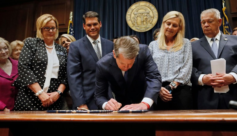Surrounded by supporters of the bill, including Sen. Renee Unterman (from left), R - Buford, Lt. Gov. Geoff Duncan, First Lady Marty Kemp, and House Speaker David Ralston, Gov. Brian Kemp signed HB 481, the "heartbeat bill", on Tuesday, May 7, 2019 in Atlanta, setting the stage for a legal battle as the state attempts to outlaw most abortions after about six weeks of pregnancy.