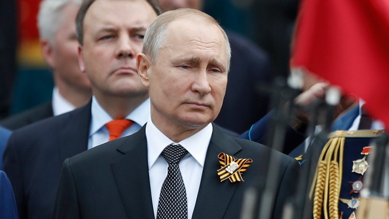Russian President Vladimir Putin attends a wreath-laying ceremony at the Tomb of the Unknown Soldier.