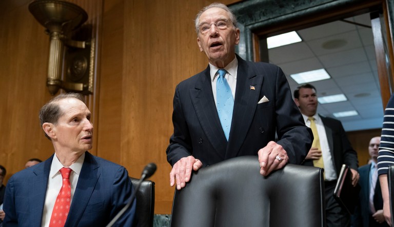 Sen. Chuck Grassley, R-Iowa, chairman of the Senate Finance Committee, center, joined at left by Sen. Ron Wyden, D-Ore., the ranking member, arrives for the start of a hearing called "Challenges in the Retirement System," on Capitol Hill in Washington, Tuesday, May 14, 2019.