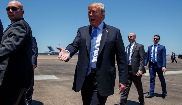 President Donald Trump reaches out to greet supporters after arriving at Chennault International Airport, Tuesday, May 14, 2019, in Lake Charles, La. 