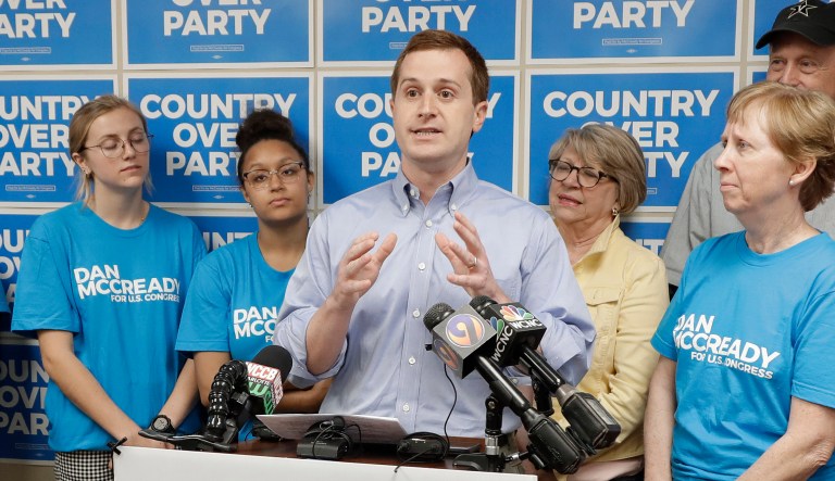 Ninth Congressional District Democratic candidate Dan McCready (center) answers a question during a news conference in Charlotte, N.C.