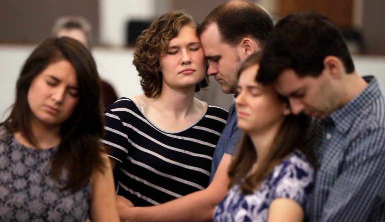 Abigail and Jonathan Dysinger, center, pray during a vigil for Donnie Johnson, Thursday, May 16, 2019, in Nashville, Tenn. Johnson was executed by lethal injection Thursday for suffocating his wife, Connie Johnson, in a Memphis camping center that he managed in 1984. The vigil was held at Riverside Seventh-Day Adventist Church, where Johnson served as an elder while in prison, even though he was never able to visit the church.