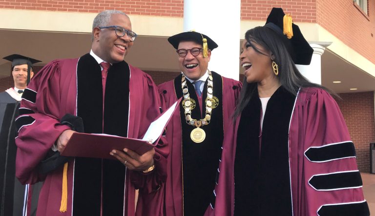 Robert F. Smith, left, laughs with David Thomas, center, and actress Angela Bassett at Morehouse College on Sunday, May 19, 2019, in Atlanta. 