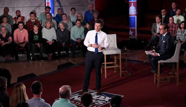 Democratic presidential candidate South Bend, Ind., Mayor Pete Buttigieg, center, answers a question during a FOX News Channel town hall moderated by Chris Wallace in Claremont, N.H.