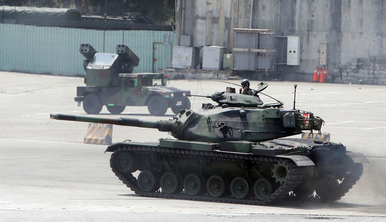 Taiwan military personnel maneuver a tank during an exercise at the port in Hualien County, Taiwan.