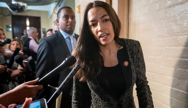 Rep. Alexandria Ocasio-Cortez, D-N.Y., followed by Rep. Joe Neguse, D-Colo., responds to reporters' questions after Speaker of the House Nancy Pelosi, D-Calif., met with all the House Democrats, many calling for impeachment proceedings against President Donald Trump after his latest defiance of Congress by blocking his former White House lawyer from testifying yesterday, at the Capitol in Washington, Wednesday, May 22, 2019.