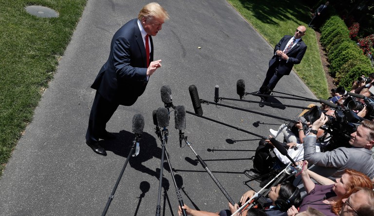 President Donald Trump speaks to members of the media on the South Lawn of the White House in Washington, Friday, May 24, 2019, before boarding Marine One for a short trip to Andrews Air Force Base, Md., and then on to Tokyo.