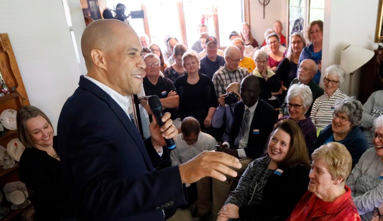 Democratic presidential candidate Sen. Cory Booker, D-N.J., speaks during a house party in Newton, Iowa. 