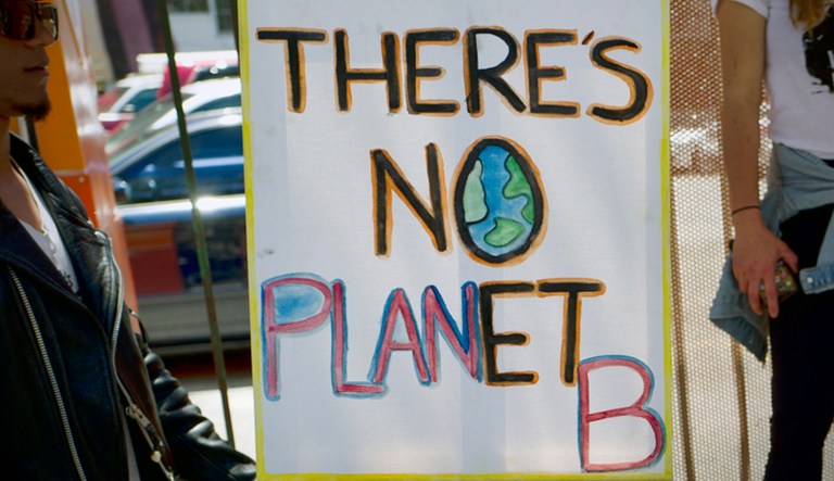 A protest sign against climate change says, "There is no Planet B."