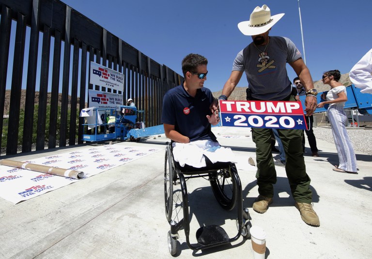 We Build the Wall Founder Brian Kolfage, left, and David Clarke Jr., a board member of the group, prepare for a news conference.