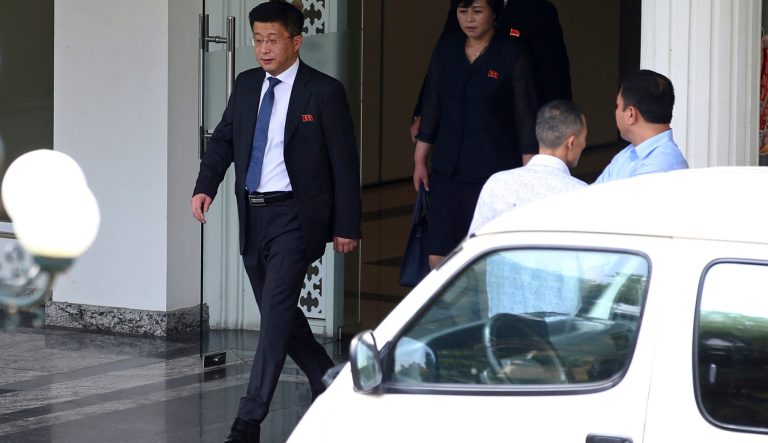 In this Feb. 21, 2019, photo, Kim Hyok Chol, left, North Korea's special representative for U.S. affairs, leaves the Government Guest House in Hanoi, Vietnam. 
