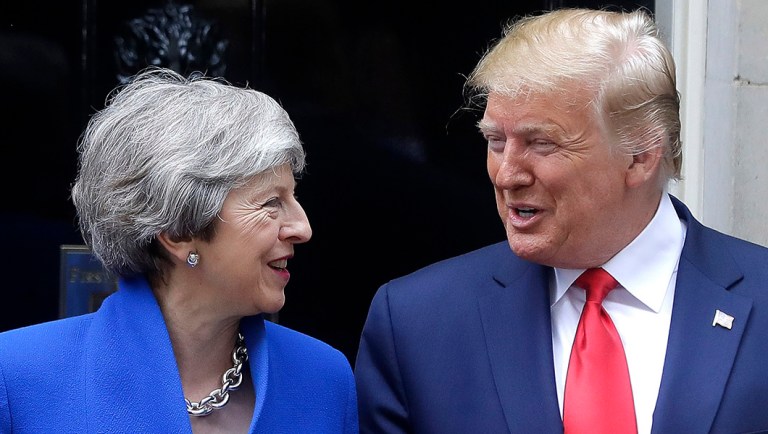 Britain's Prime Minister Theresa May greets President Donald Trump outside 10 Downing Street.