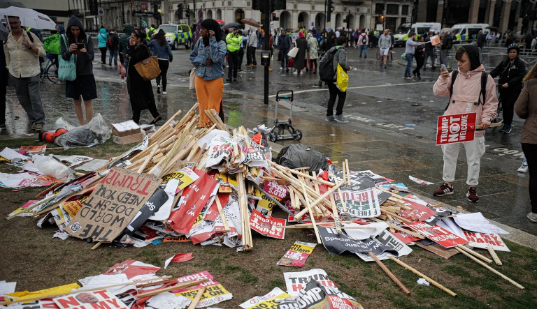 Placards showing anti-Trump messages lie on the ground, in central London, near the end of a protest against the state visit of President Donald Trump, Tuesday, June 4, 2019. Trump will turn from pageantry to policy Tuesday as he joins British Prime Minister Theresa May for a day of talks likely to highlight fresh uncertainty in the allies' storied relationship.