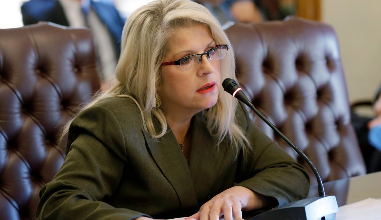 FILE - In this Jan. 28, 2015 file photo, Sen. Linda Collins-Smith, R-Pocahontas, speaks at the Arkansas state Capitol in Little Rock, Ark. Authorities in Arkansas say they're investigating as a homicide remains found outside the home of the former state senator who Republican Party officials say is dead. An Arkansas State Police spokesman said Wednesday, June 5, 2019, that the remains were found Tuesday outside the home in Pocahontas. Police declined to identify the victim. Property records show the home belongs to Collins-Smith and her ex-husband.