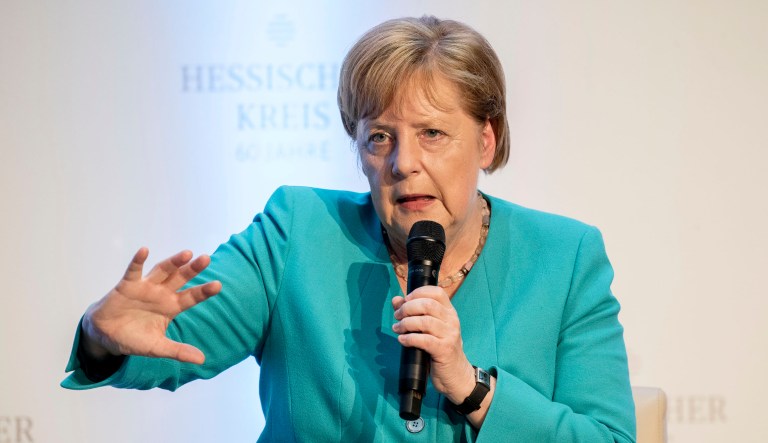 German Chancellor Angela Merkel takes part in a discussion.