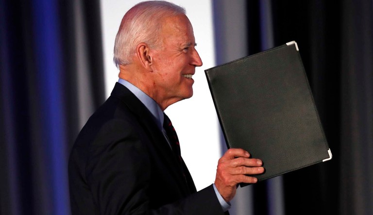 Democratic presidential candidate former Vice President Joe Biden gestures as he steps on stage before speaking during the I Will Vote Fundraising Gala Thursday, June 6, 2019, in Atlanta.