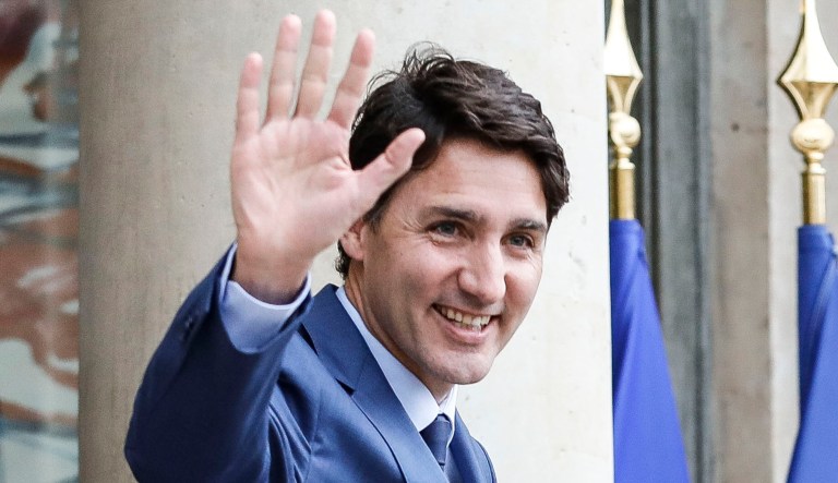 Canadian Prime Minister Justin Trudeau waves to a crowd.