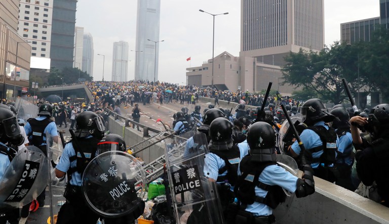 Riot police gather face off with demonstrators near the Legislative Council in Hong Kong on Wednesday.